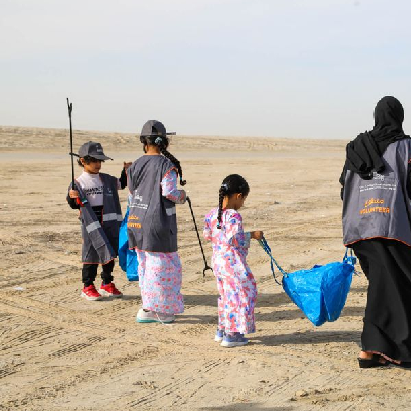 Students cleaning a beach for a conservation project
